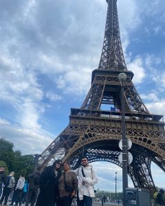 UNCG alumna Grecia Nandin in front of the Eiffel Tower.