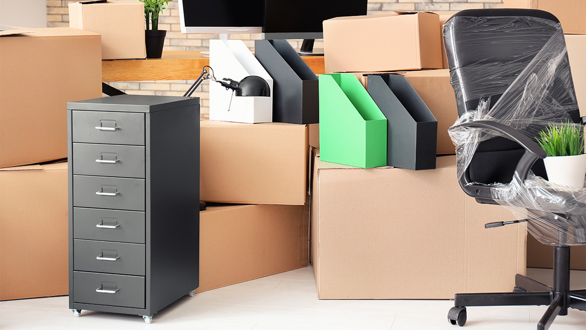 Moving boxes full of office supplies.