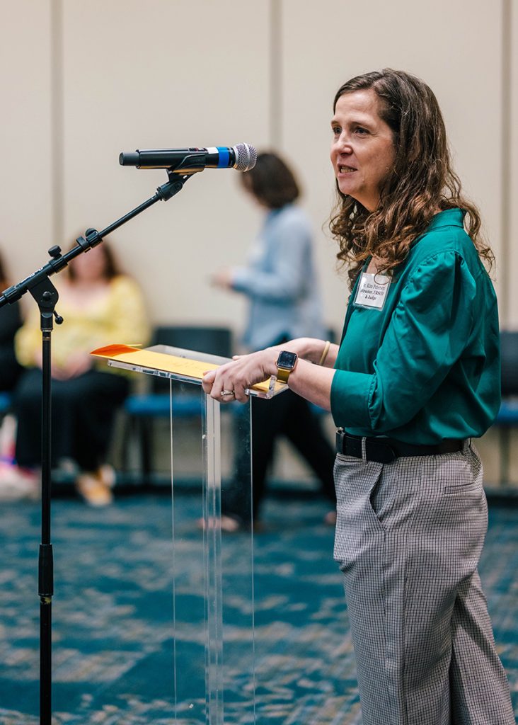 UNCG's Dr. Kimberly Petersen gives opening remarks at the Undergraduate Research Expo.
