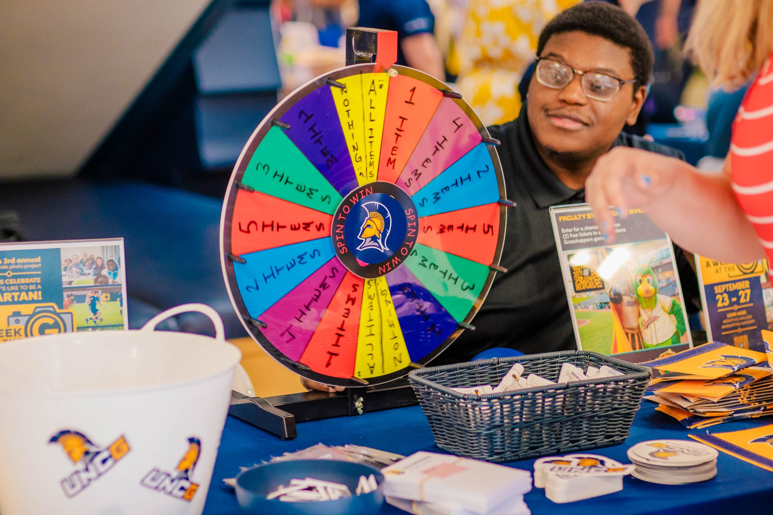 A spinning wheel for UNCG faculty and staff to win swag.