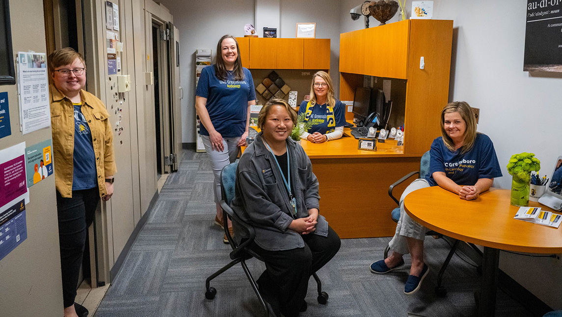 Staff sitting inside the UNCG Speech and Hearing Center.