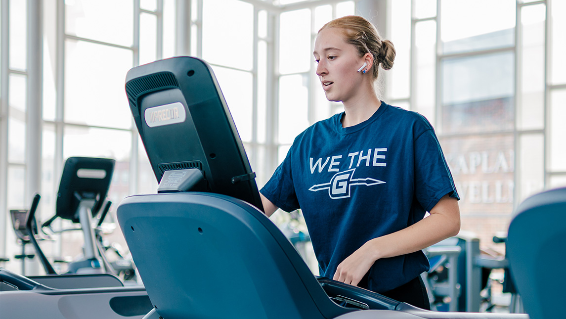 A woman runs on a treadmill at UNCG Kaplan Center.