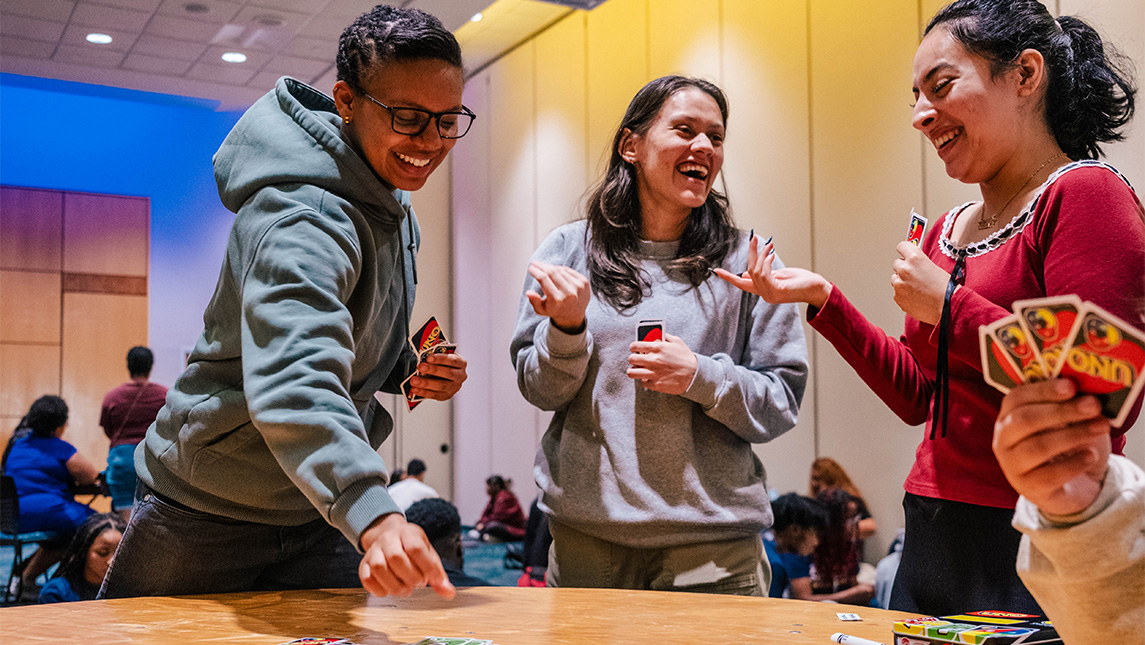 UNCG students draw UNO cards.