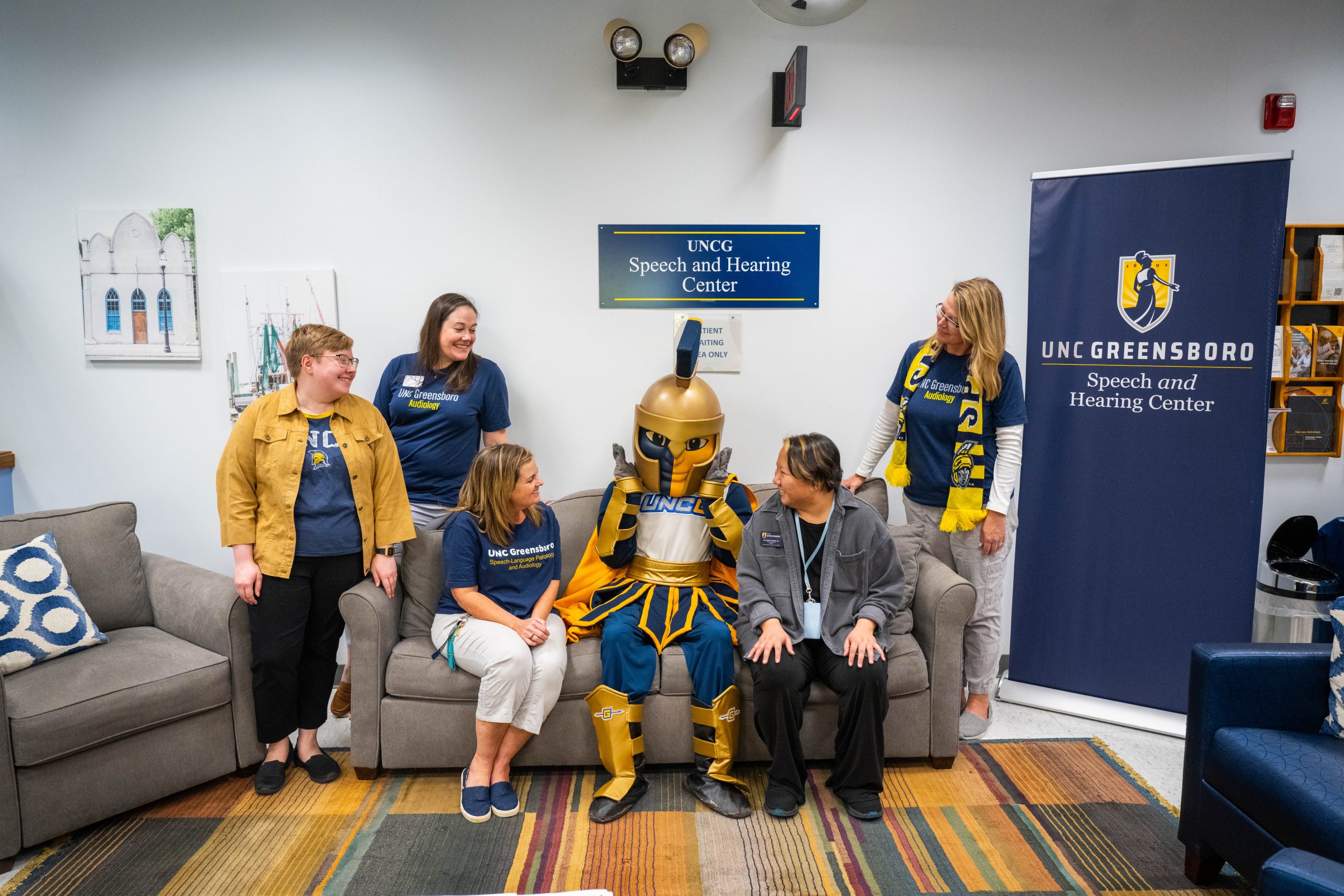 speech and hearing center staff posing with Spiro