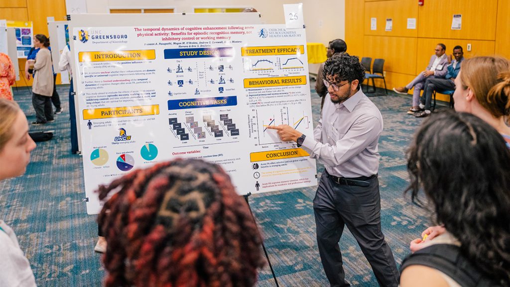 Praveen Pasupathi presents his UNCG kinesiology research at the 2025 Graduate Research Expo.
