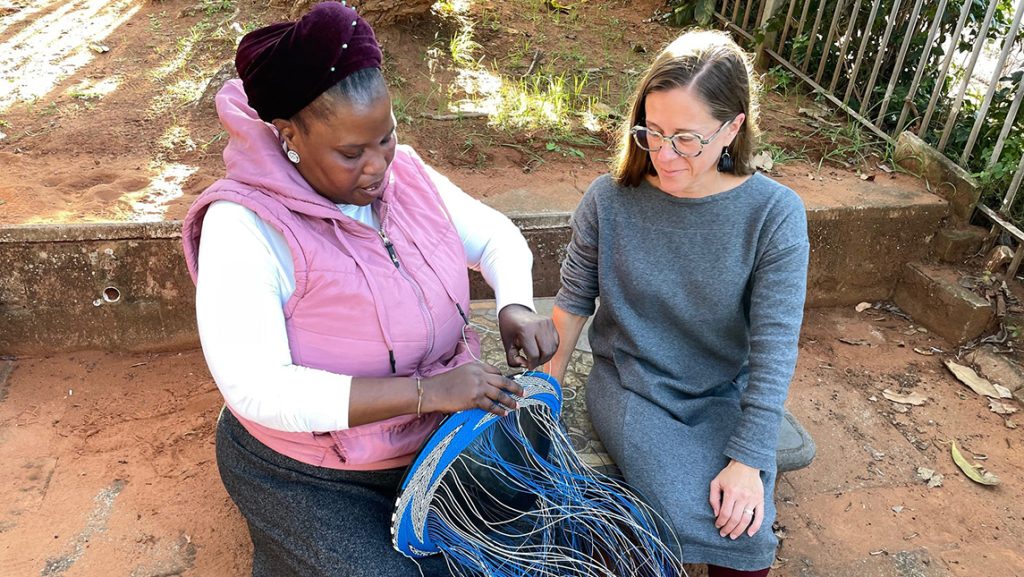 Bongeleni Mkhize and Dr. Perrill discussing weaving patterns.