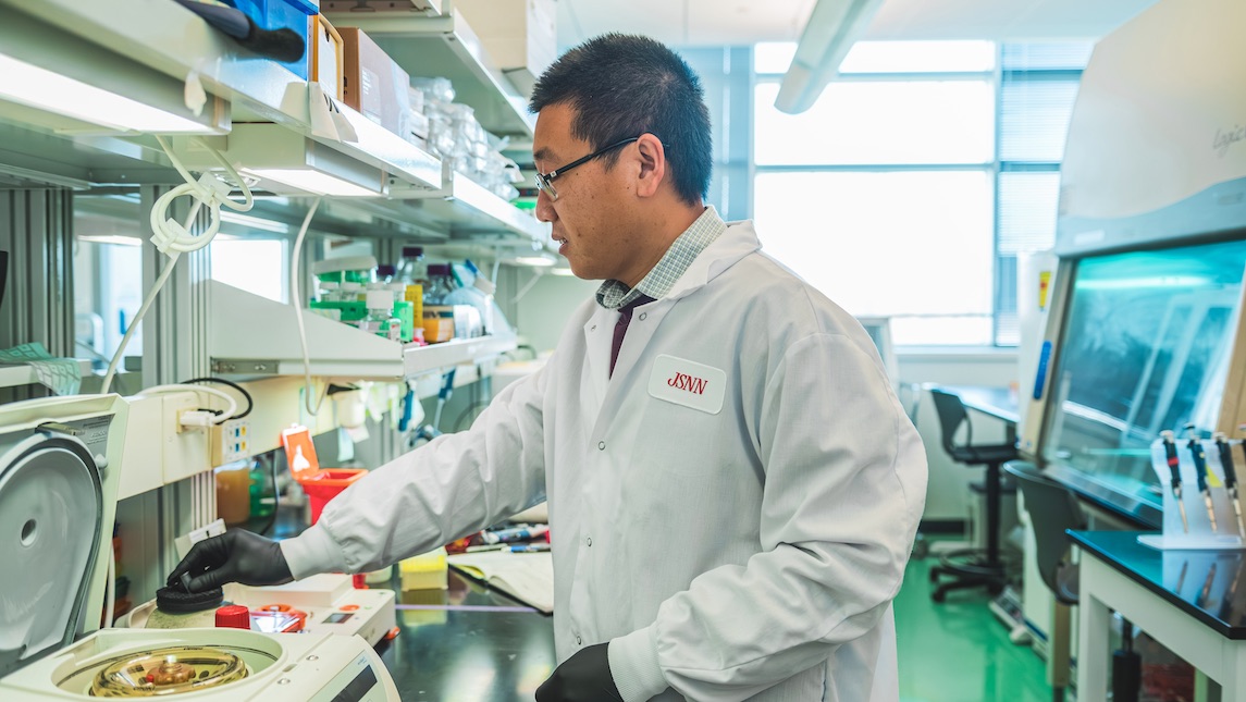 Dr. Tianqi Song working in the JSNN lab.