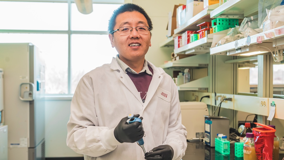 Dr. Tianqi Song working in the JSNN lab.