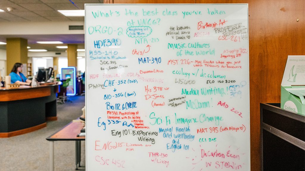 A whiteboard where UNCG students have written their favorite classes.