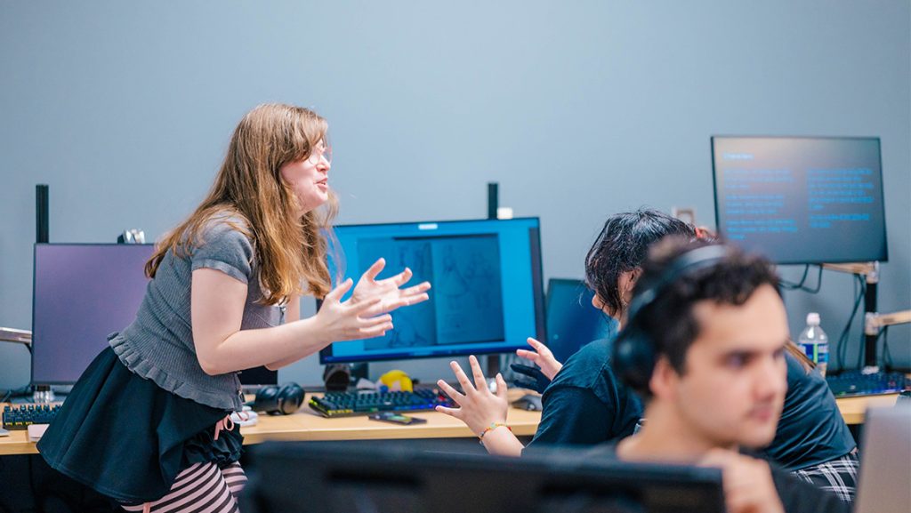 A UNCG student describes an animation scene.