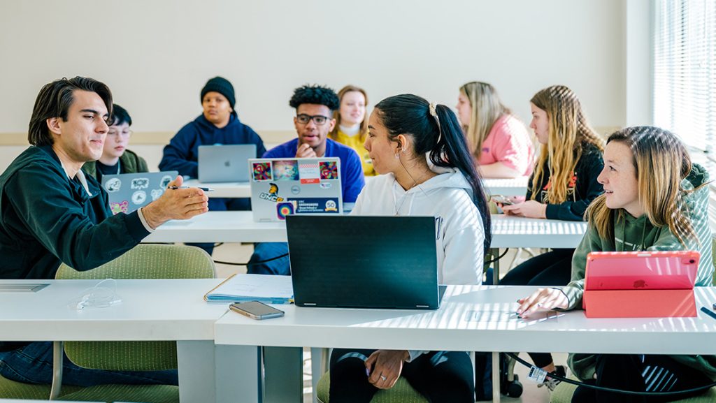 UNCG students lead a classroom discussion.