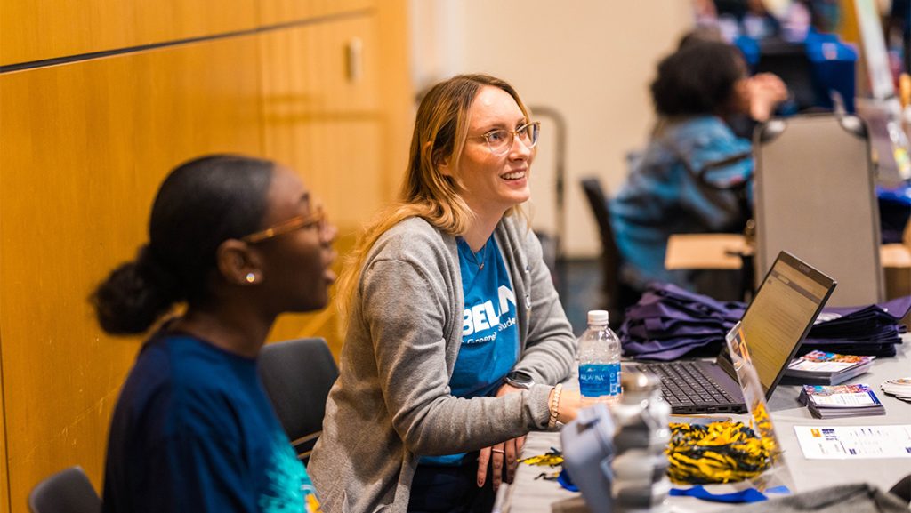 UNCG Student Affairs staffer Nicole Merritt tables for a "Be Well, Stay Well" event.