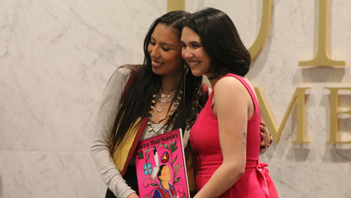 Raven Dial-Stanley poses with her coloring book.