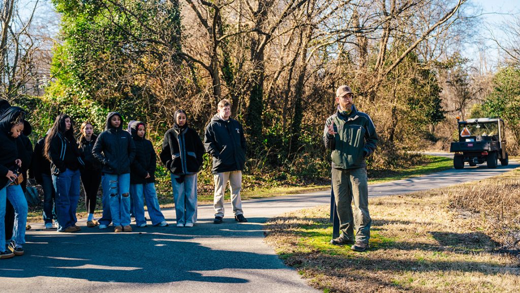 UNCG Professor Kevin Wilcox talks to students in Peabody Prairie.