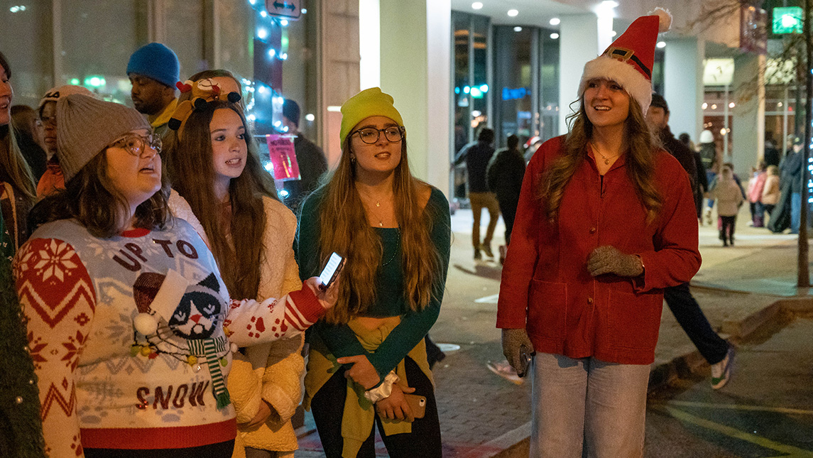 UNCG Chariots sing at a downtown holiday event.