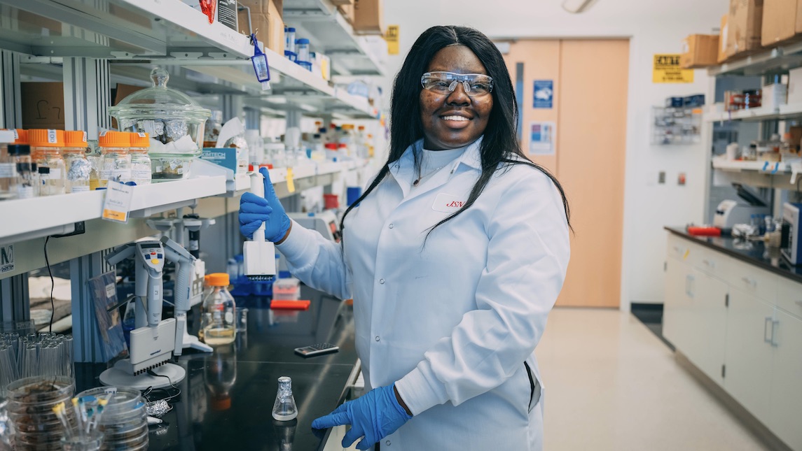 JSNN graduate Patience Kwara working in the lab.