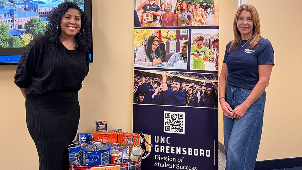UNCG Student Support staff with donated canned goods.