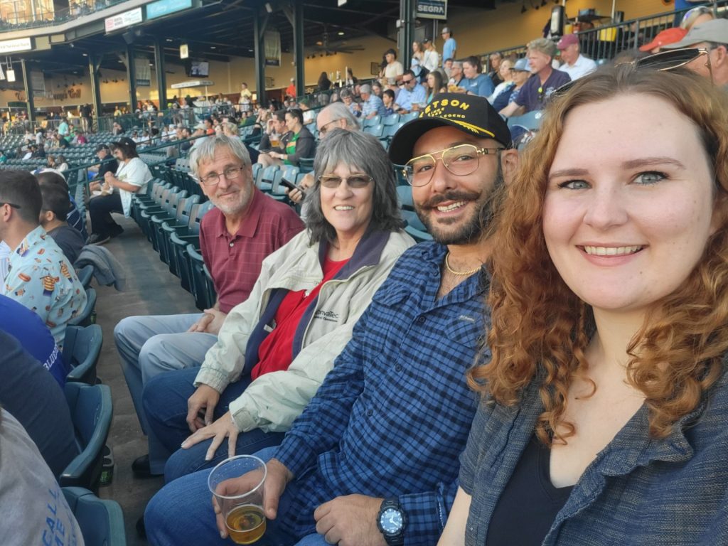 UNCG's Lauren Matlosz with family watch a baseball game.