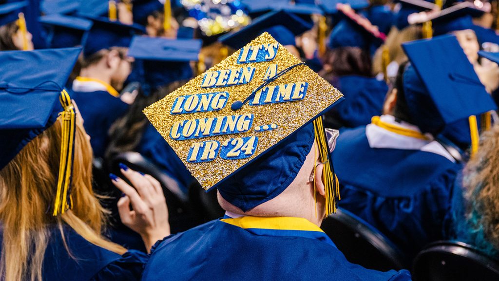 Decorated UNCG graduation cap.