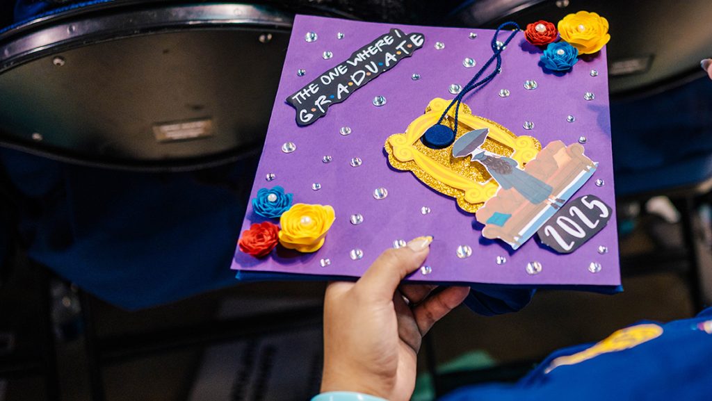 Decorated UNCG graduation cap.