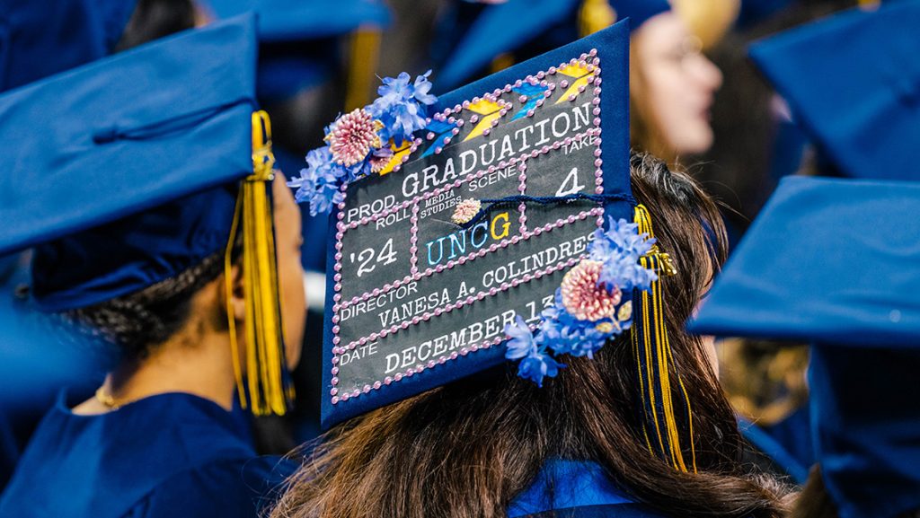 Decorated UNCG graduation cap.