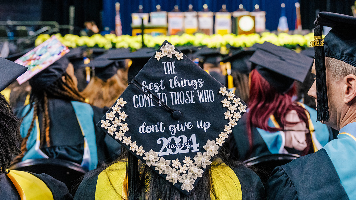 Decorated UNCG graduation cap.