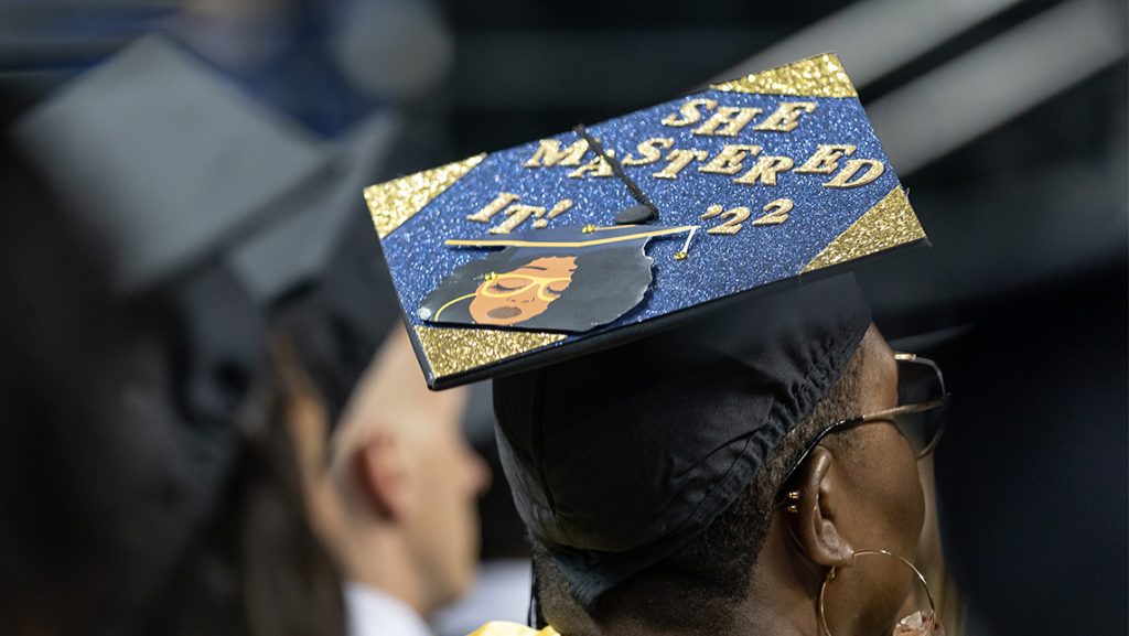 Decorated UNCG graduation cap.