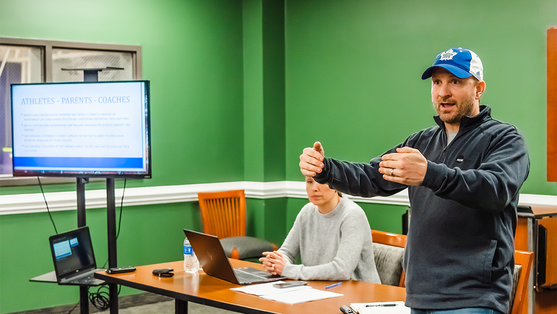 UNCG Professor Jeff Milroy speaks during a meeting.