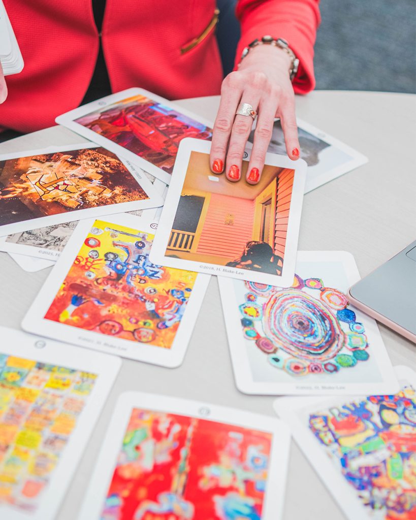 Close-up on UNCG MLIS student H. Blake-Lee concept cards for a game.