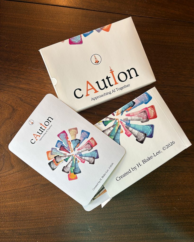 A card game's packaging titled "cAutIon."