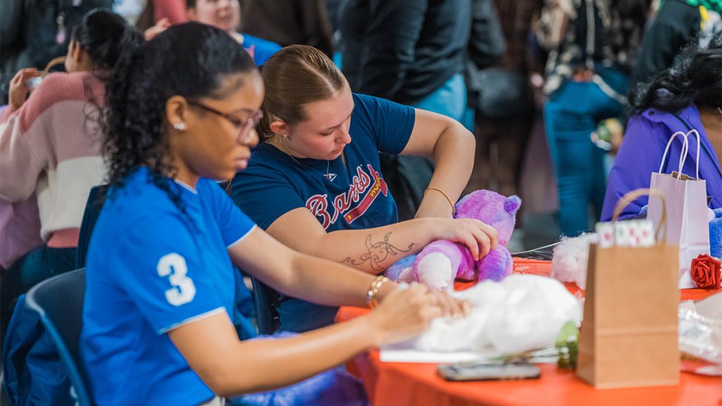 UNCG students work on Valentine's Day-themed crafts.