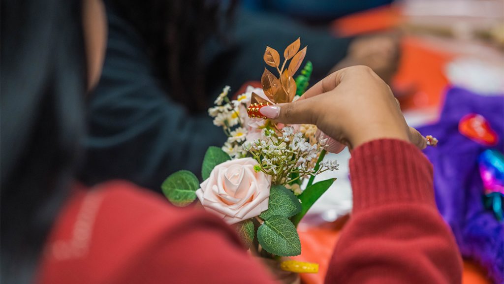UNCG students work on Valentine's Day-themed crafts.