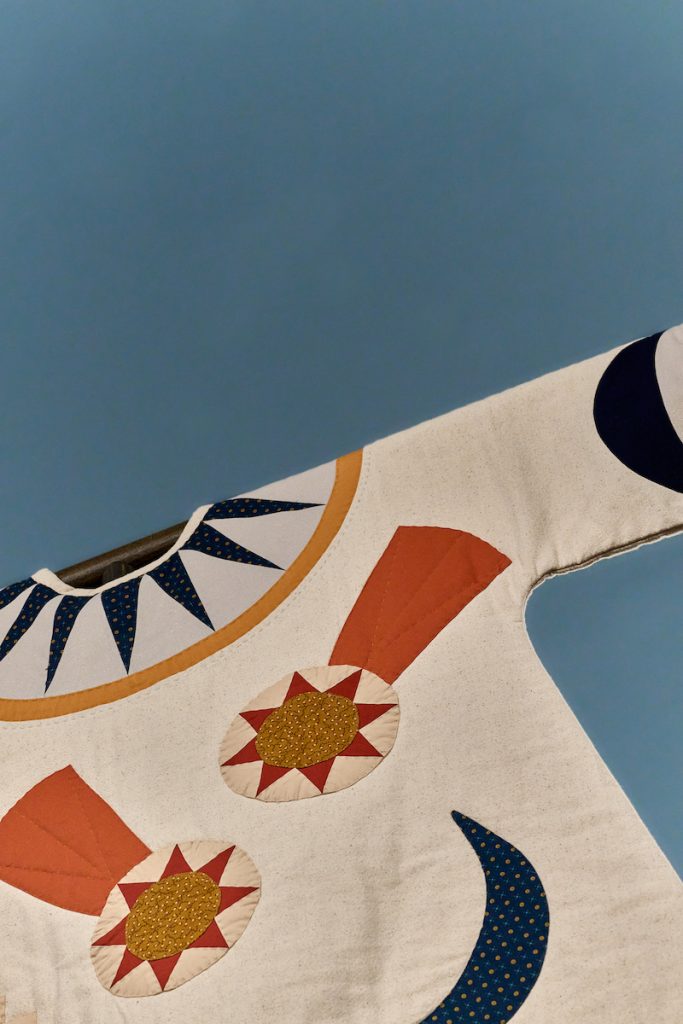 Close-up of quilt patterns in a shirt at Weatherspoon Art Museum.