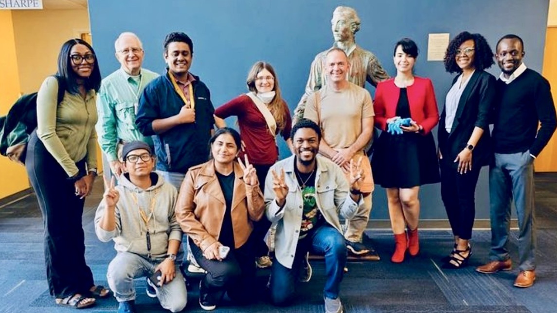 UNCG JSSN students gathered outside of a classroom.