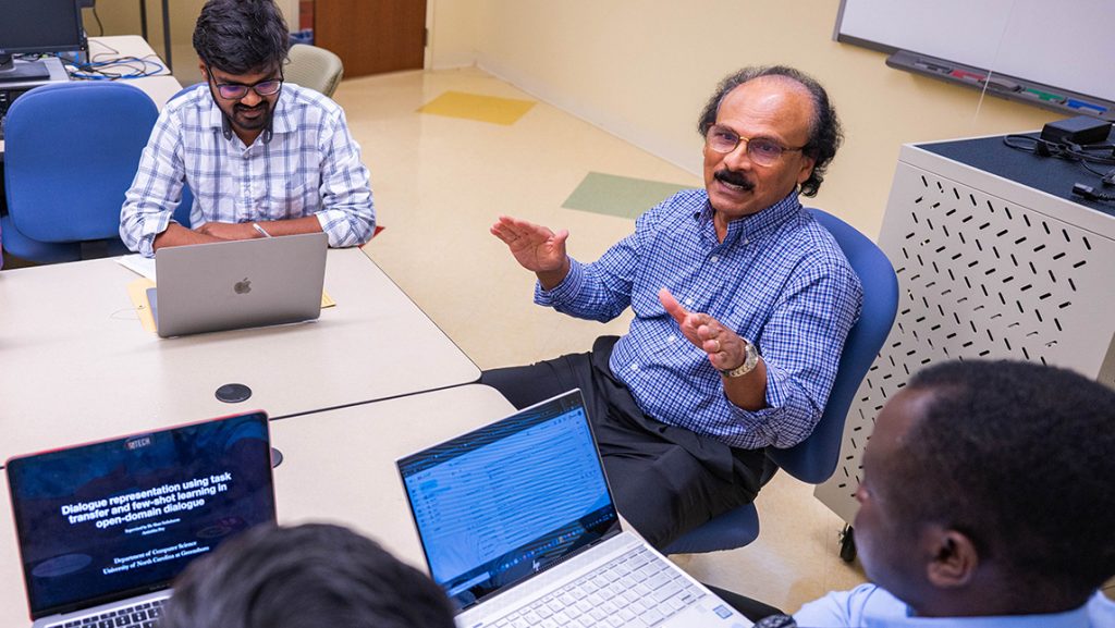 UNCG Professor Shan Suthaharan speaks to computer science students.