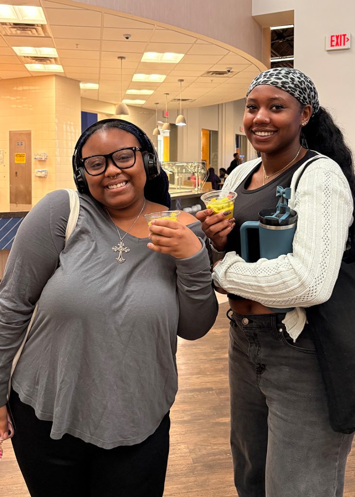 UNCG students holding smoothies.