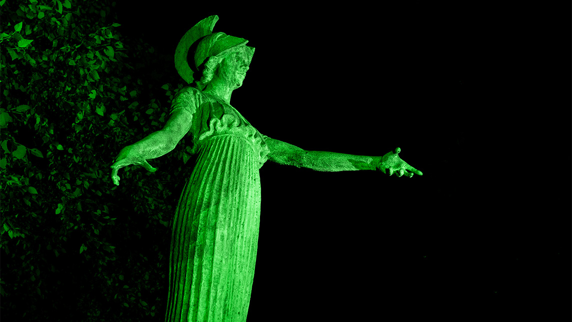 Minerva lit up in green during the UNC Systems' 