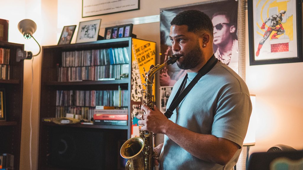 Franco Romero practices on the saxophone.
