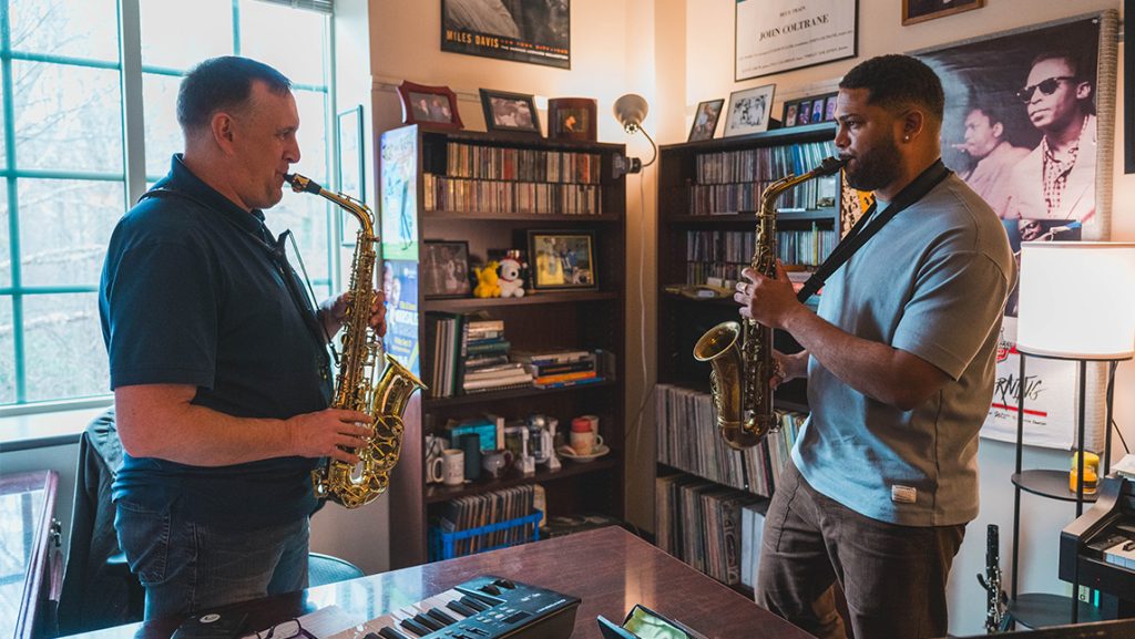 Franco Romero and his UNCG professor Chad Eby play saxophones.