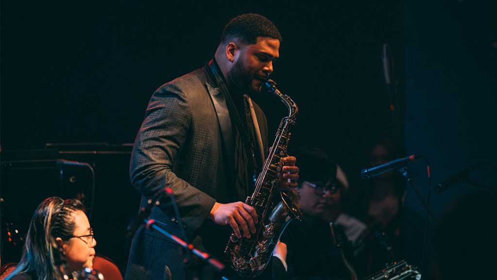 UNCG student Franco Romero plays the saxophone at a concert.