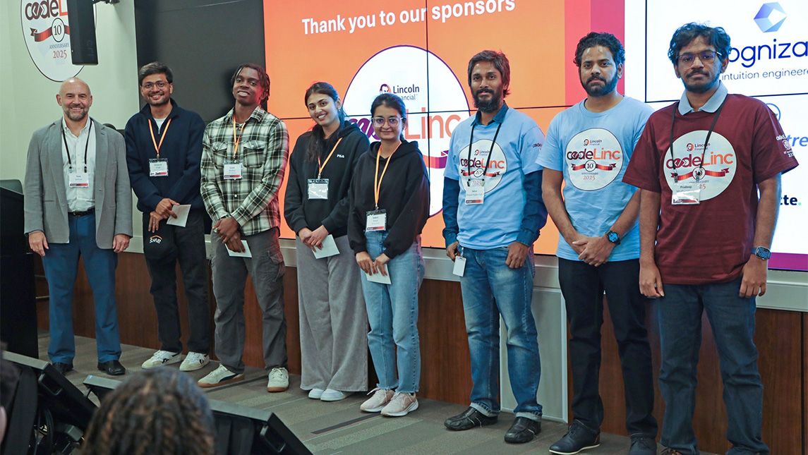 Students lined up on a stage.