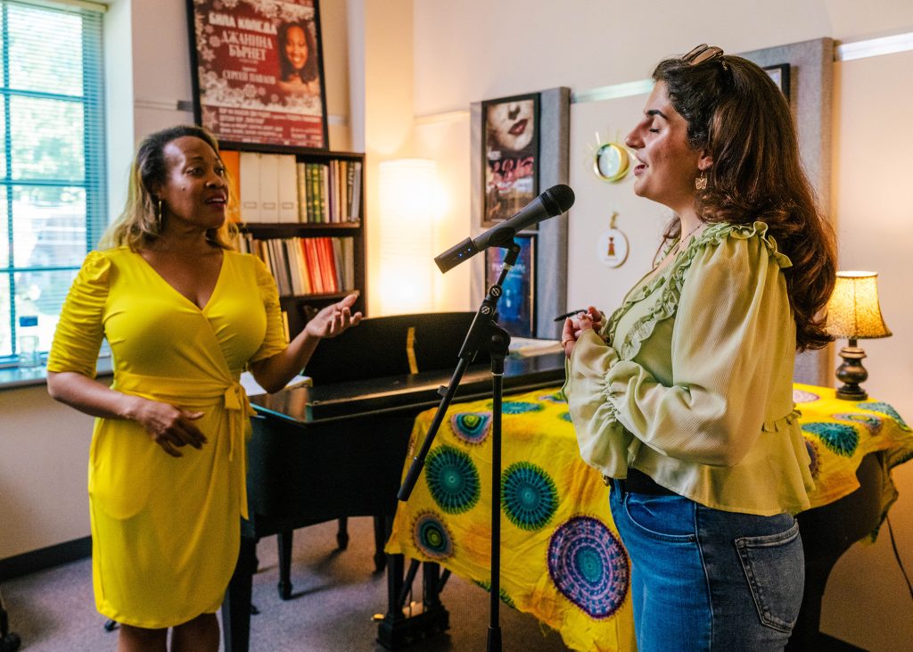 Student works with a vocal coach.