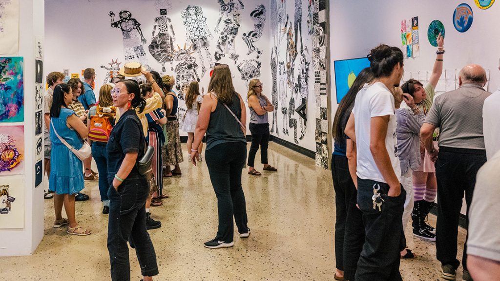 Children walk around the UNCG Gatewood art gallery.