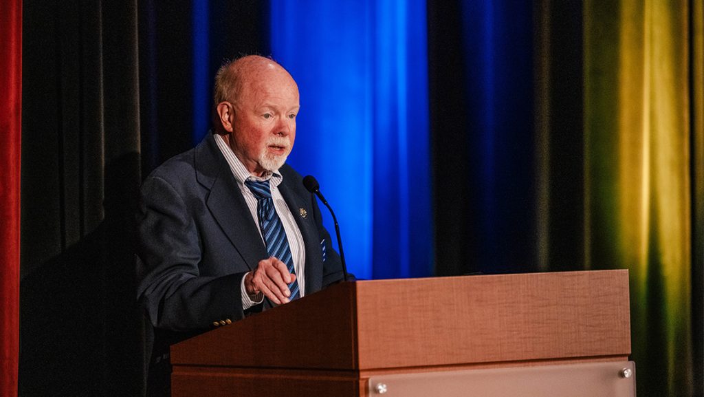 UNCG Library Dean Michael Crumpton at a podium.