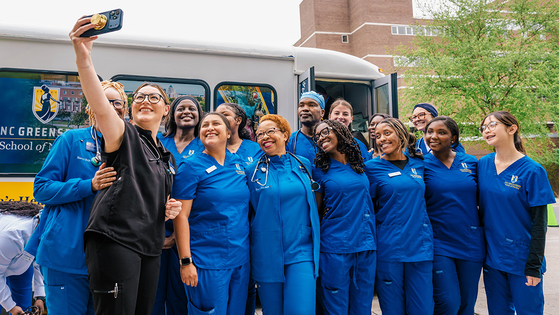 UNCG nursing students take a group selfie with Dean Barksdale.