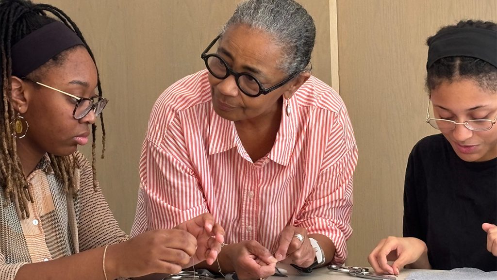 Precious D. Lovell talks with UNCG students.
