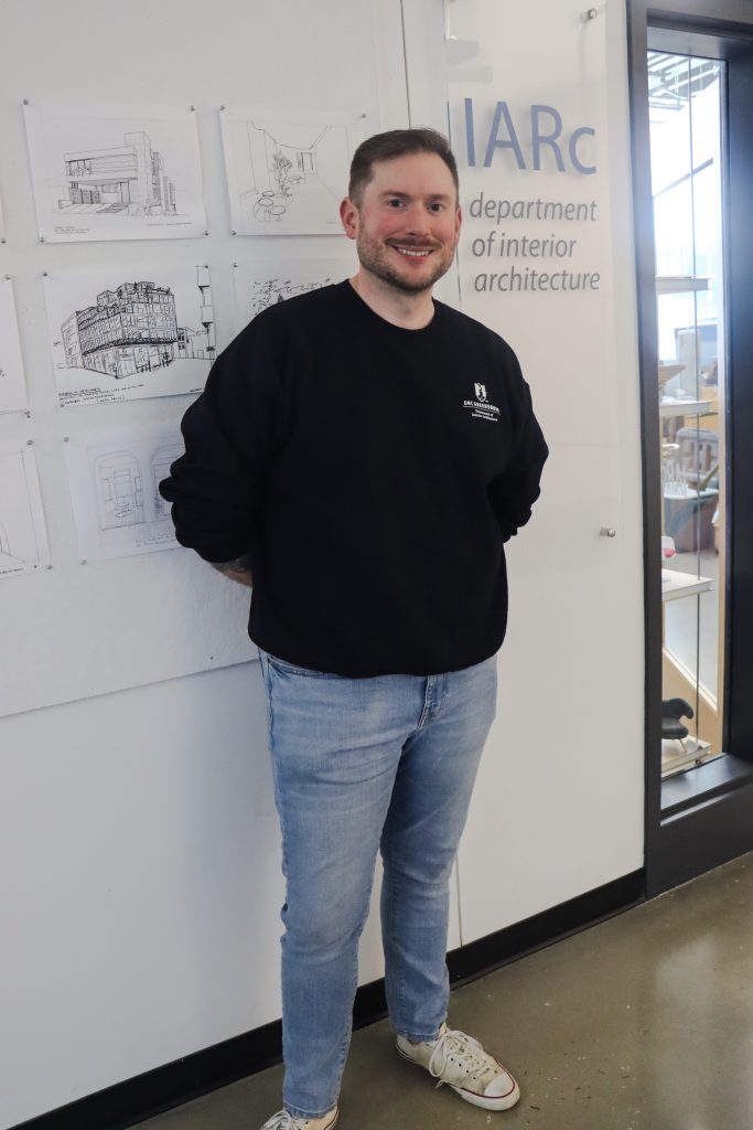 Jason Rich stands outside the main entry to the Interior Architecture Department in Gateway Studios.