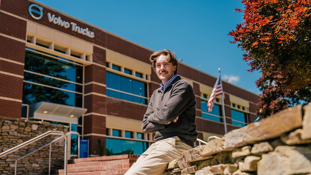 Student gives a confident pose outside of Volvo's North American headquarters.