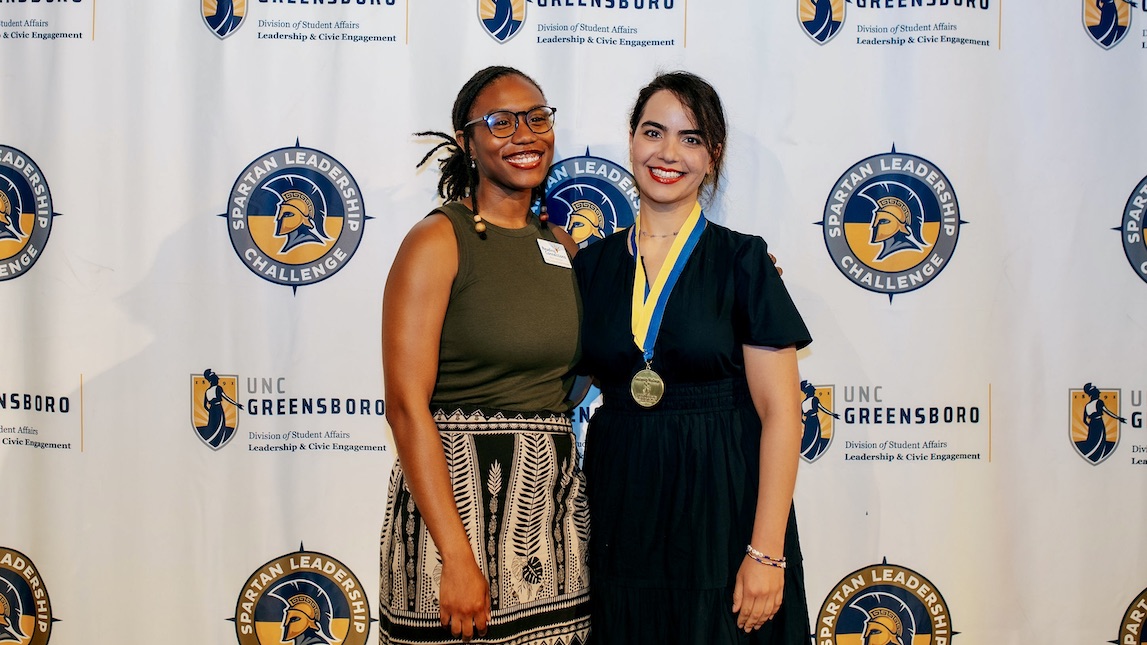 UNCG JSNN graduate student Nooshin poses with her medal.