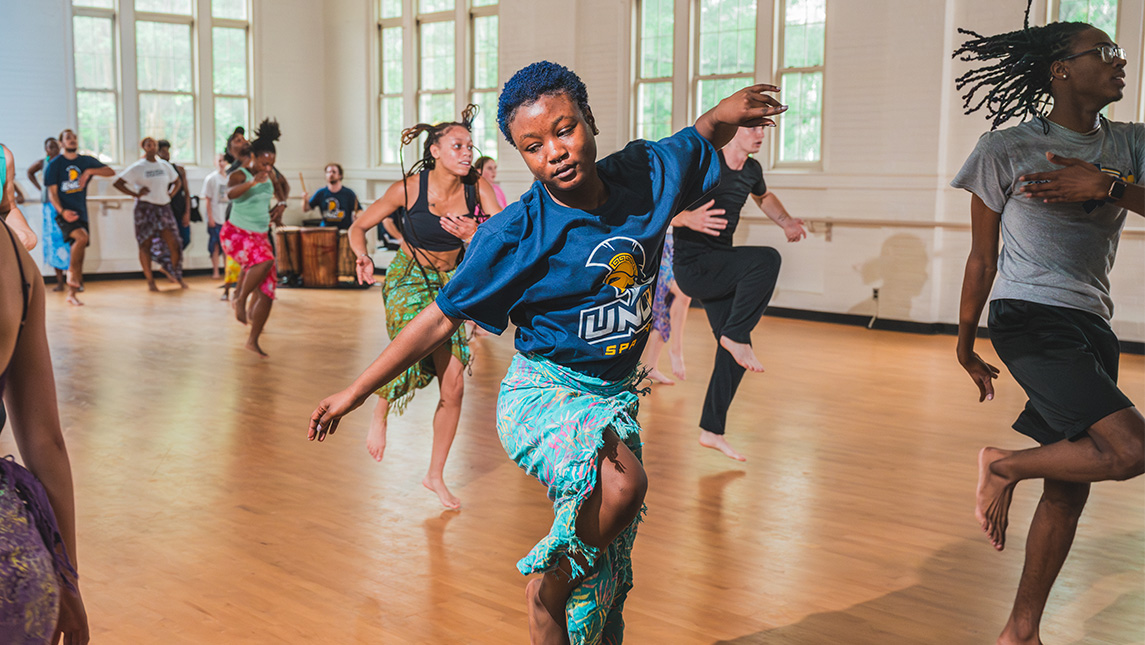 Carina Young dances in the studio.